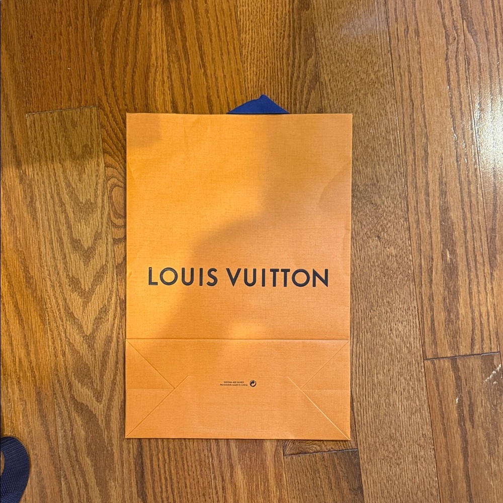 Louis Vuitton Vibrant Orange Bag with Blue Accent